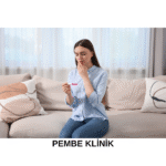 An Omani woman in hijab receiving medical counseling in a hospital about pregnancy risks under legal restrictions